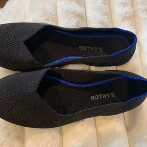 Rothy's Elegant Black Flats with Vibrant Blue Accent